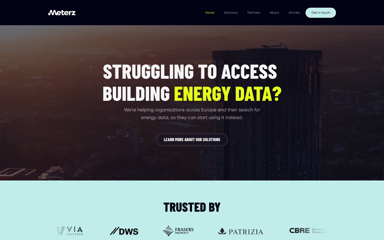 The Meterz homepage: a dark hero over a city skyline asking whether you are struggling to access building energy data